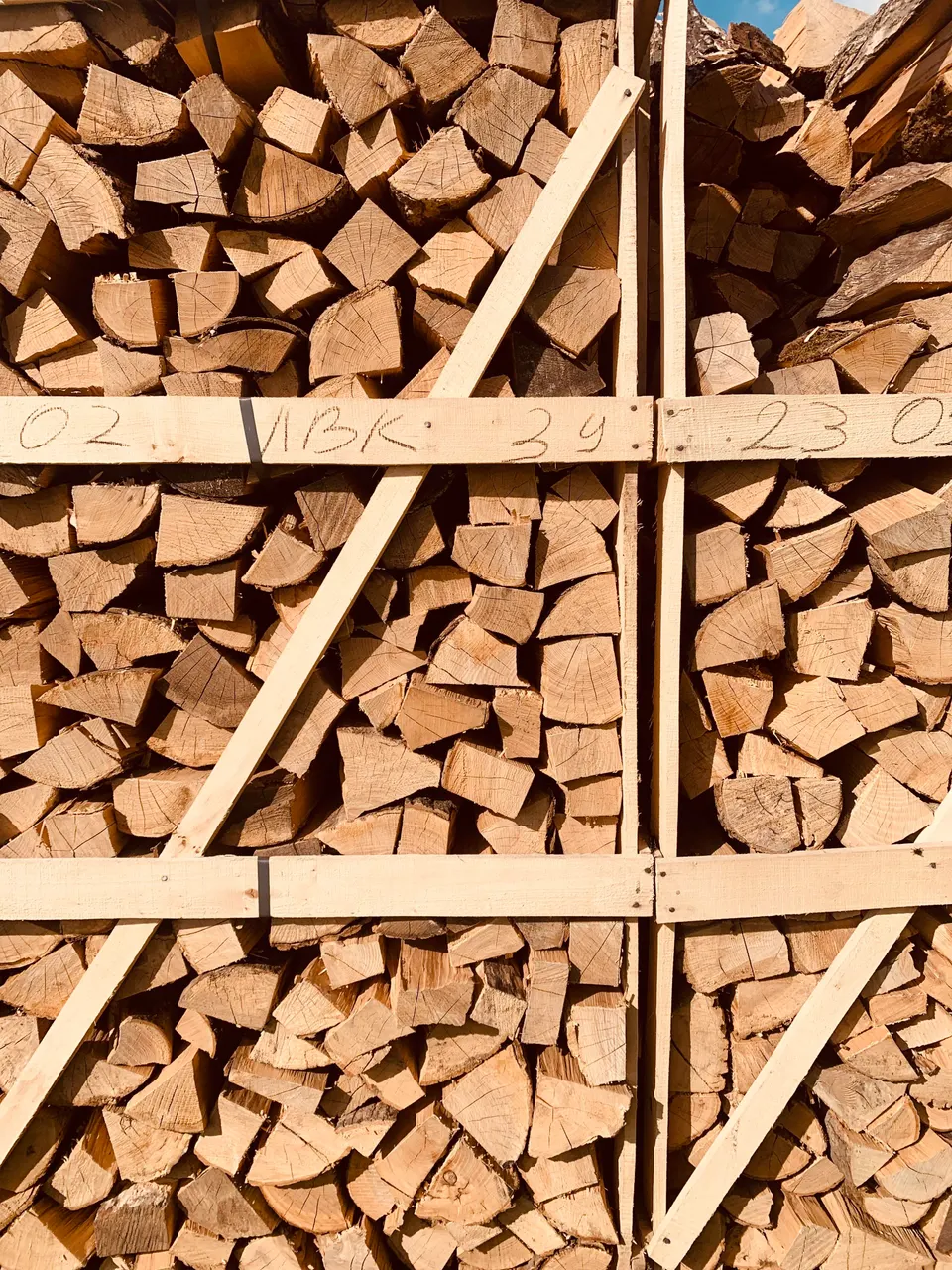 Stacked firewood in a wooden crate